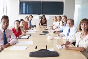 Group of diverse business people in boardroom for a meeting
